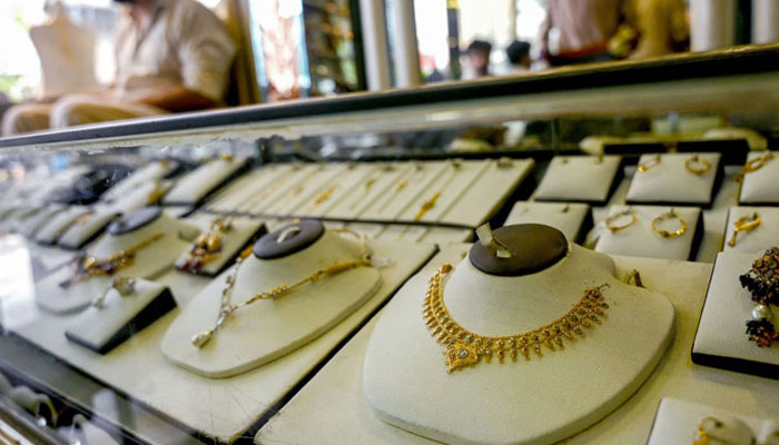 A jeweller waits for a customers at a shop in Karachi on June 26, 2024. — AFP