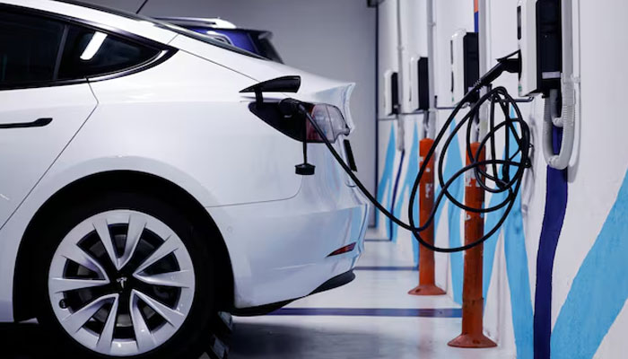 An electric vehicle is plugged into a charging station in Bilbao, Spain, February 15, 2023. — Reuters