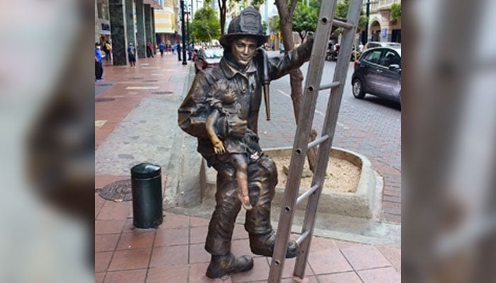 This representational image shows a Living Statue climbing on a Ladder. — Unsplash/File