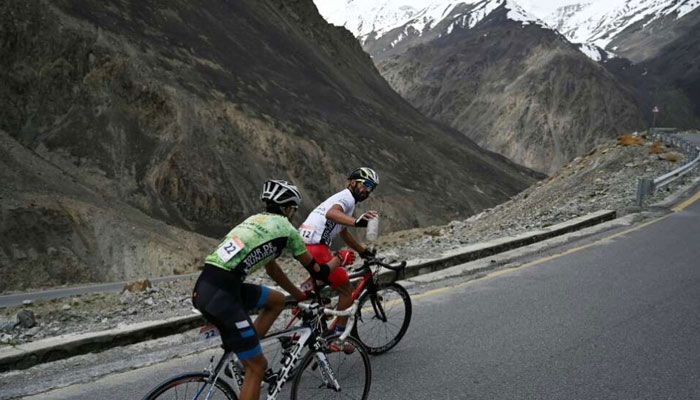 A representational image of two cyclist pictured in northern areas of Pakistan. — AFP/File