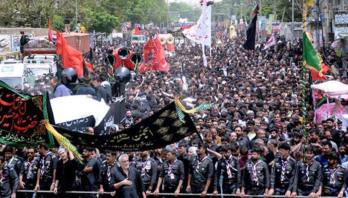 In this image a large number of people attend the 10th Muharram procession to mark Ashoura. — APP/File