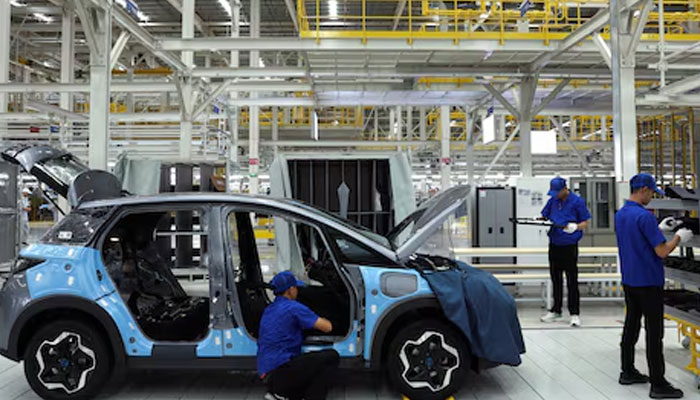 Workers assemble an EV car inside BYDs first electric vehicle (EV) factory in Southeast Asia, a fast-growing regional EV market where it has become the dominant player, in Rayong, Thailand, July 4, 2024. —Reuters