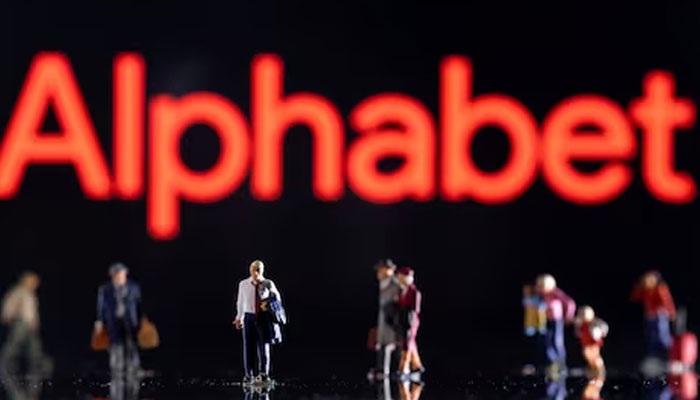 Small figurines are seen in front of displayed Alphabet logo in this illustration taken February 11, 2022. —Reuters