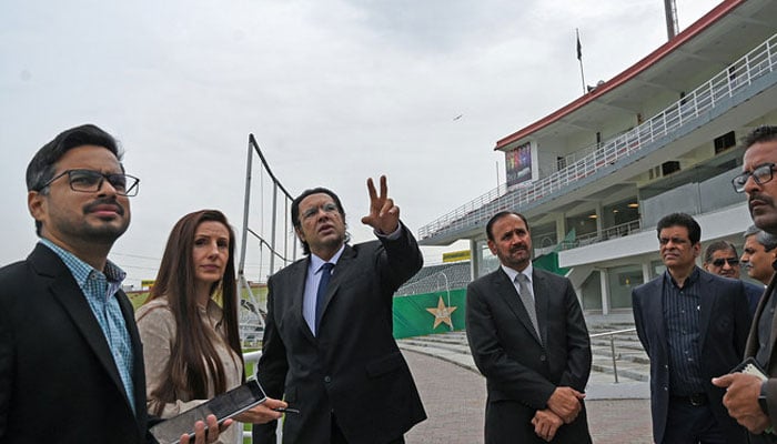 Sarah Edgar (2nd left), Senior Manager for event operations at International Cricket Council (ICC) and manager Aun Zaidi (left) along with Usman Wahla (center), Director of International cricket at Pakistan Cricket Board (PCB), review preparations for the Champions Trophy 2025 at the Rawalpindi Cricket Stadium in Rawalpindi on March 27, 2024. — AFP