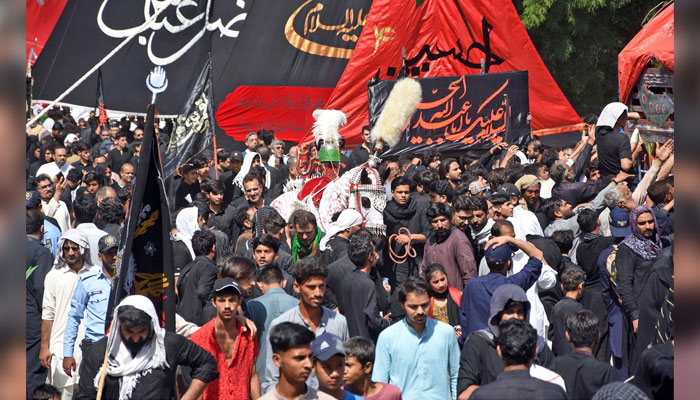 Mourners take part in a procession in remembrance of Imam Husseins (RA) martyrdom on 9th Muharram-ul-Haram in Islamabad on July 16, 2024. — Online