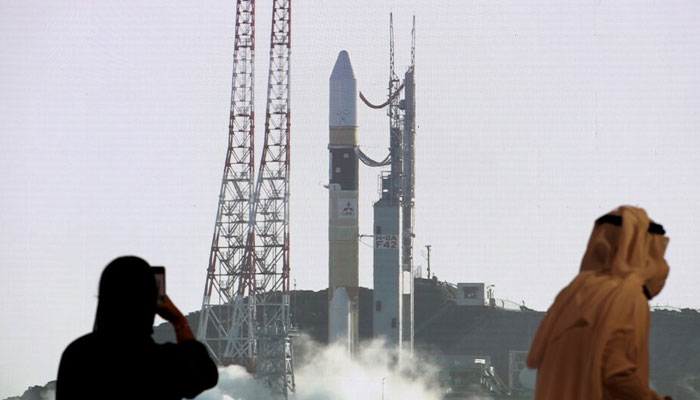 People view a big screen displaying the booster rocket of the Hope Probe ahead of its launch from Tanegashima Island in Japan, at the Mohammed bin Rashid Space Centre in Dubai, United Arab Emirates July 20, 2020. — Reuters