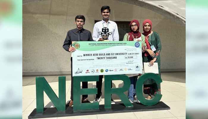 Students pose for a photo with a prize cheque at the National Engineering Robotics Contest (NERC) on July 18, 2024. — Facebook/NUST