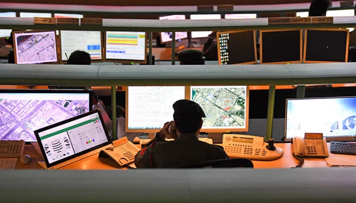 Police officers monitor the streets and receive calls from citizens at the Command and Control Center of Dubai Police in the Gulf Emirate. — AFP/File