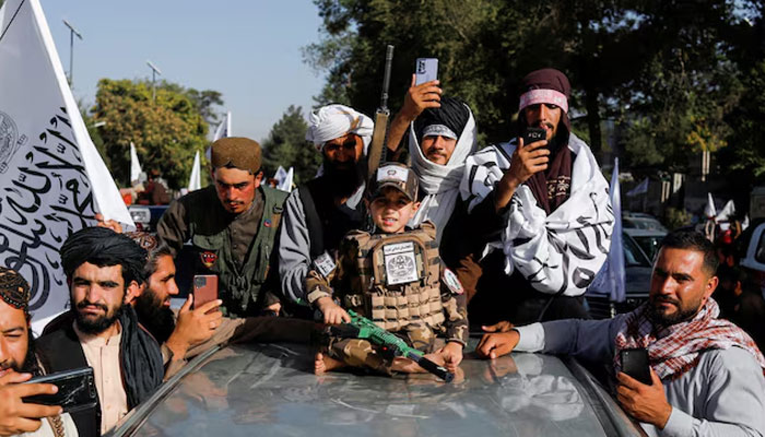 Taliban supporters celebrate the second anniversary of the fall of Kabul at a street near the U.S. embassy in Kabul, Afghanistan, on August 15, 2023. — Reuters