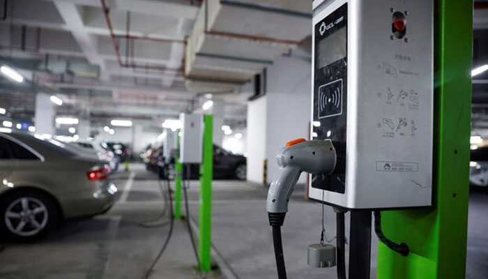 A electric car charging station is pictured in a parking lot on March 13, 2021. — Reuters