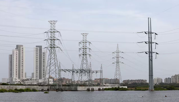 Power transmission towers are pictured in Karachi, Pakistan July 26, 2022. — Reuters