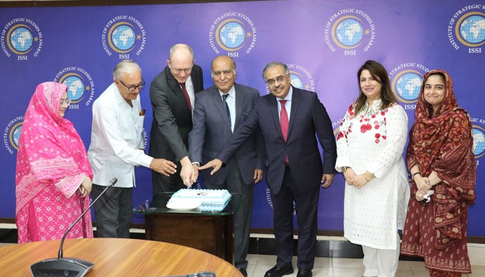 Participants cut a cake to celebrate Nelson Mandela International Day 2024 organised by the Institute of Strategic Studies (ISS) on July 18, 2024. — Facebook/Institute of Strategic Studies Islamabad