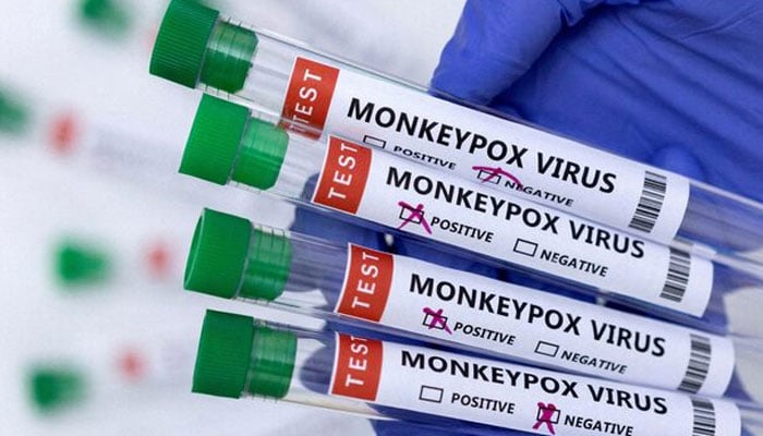 Test tubes labelled Monkeypox virus positive and negative are seen in this image on May 23, 2022. — Reuters