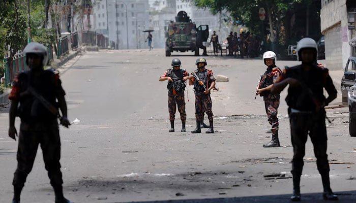 Members of Border Guard Bangladesh (BGB) stand guard outside the state-owned Bangladesh Television as violence erupts after anti-quota protests by students, in Dhaka, Bangladesh, July 19, 2024. — Reuters