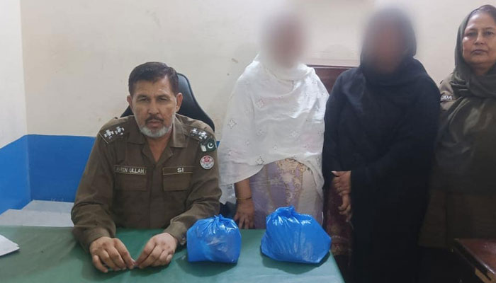 This image shows Police officials along with recovered drugs and female drug dealers on July 21, 2024. — Facebook/Rawalpindi Police