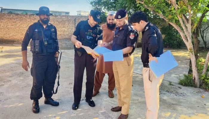 KP Police personnel stand in Charsadda, KP. — X/@KP_Police1/File