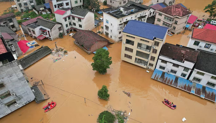 Aerial view of buildings submerged in floodwaters after heavy rains hit towns in Hunan province, eastern China on July 2, 2024. — Reuters