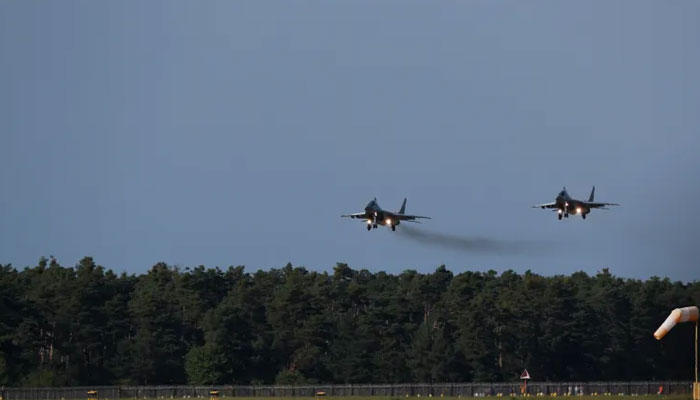 Two fighter jets seen taking off in this image . — Reuters/file