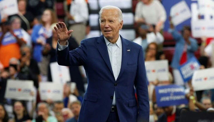 US President Joe Biden waves to his supporters during a campaign stop in Detroit, US, July 12, 2024. — Reuters