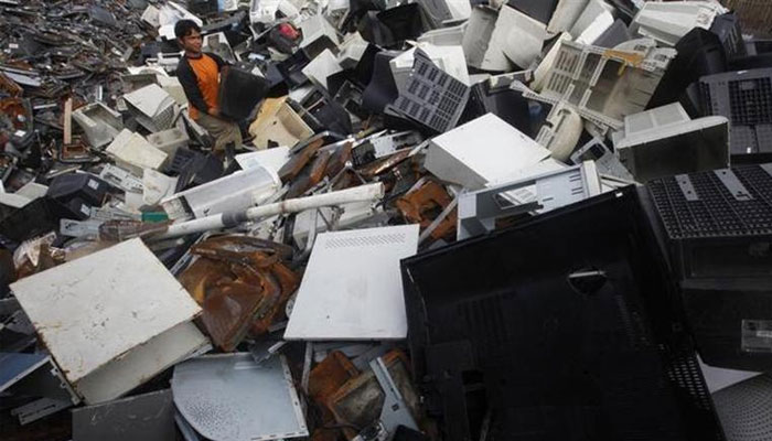 A worker selects various parts of computer waste to be sent to a factory for recycling, in the Tangerang district on the outskirts of Jakarta January 25, 2011. — Reuters