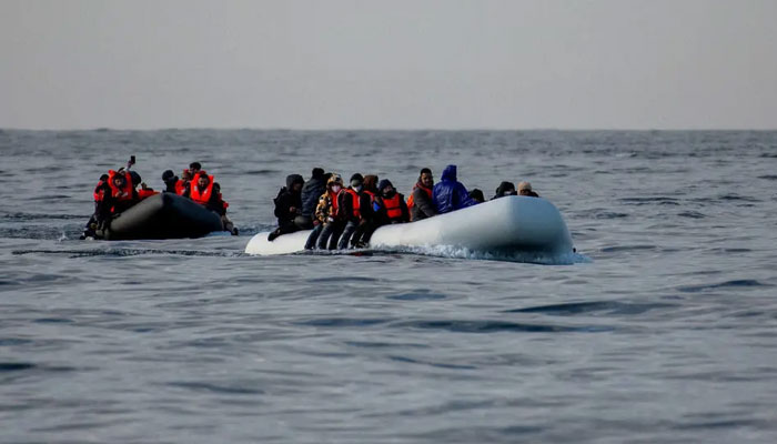 Migrants seen in two boats. — Reuters/file