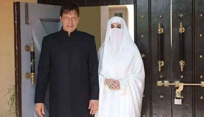 PTI founder Imran Khan with his wife Bushra Bibi. — X/@PTIofficial/File