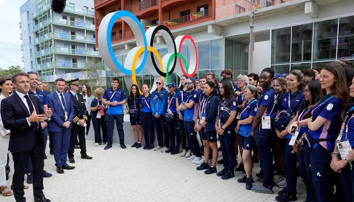 French President Emmanuel Macron meets with French athletes during his Olympic visit to the 2024 Summer Olympics on July 22, 2024. — Reuters