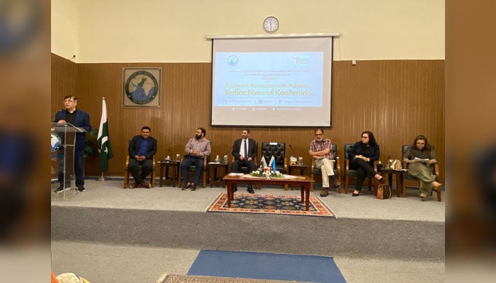 Participant addresses a seminar on “Kashmir’s accession with Pakistan: Reflections of Kashmiris” organised by the Institute of Regional Studies (IRS) on July 23, 2024. — Facebook/KIIR