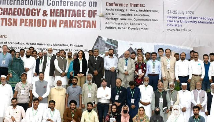 Participants pose for a group photo at a conference organised by the HU archaeological department at Hazara University on July 24, 2024. — Facebook/Hazara University