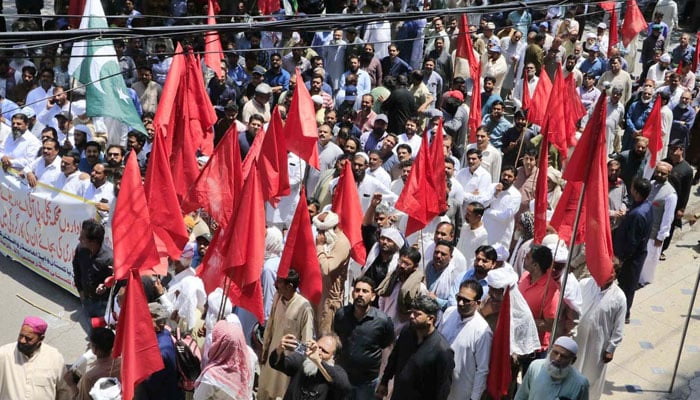 All Pakistan Federation of Trade Unions holds a rally passing through Kasib Road on the occasion of International Labour Day on May 1, 2024. — APP