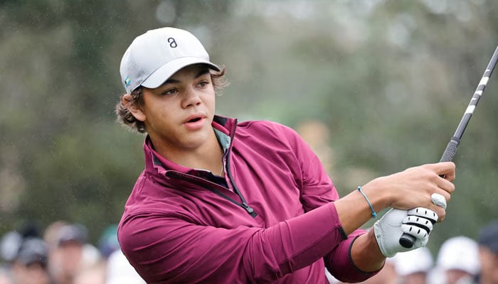 Charlie Woods plays his shot from the first tee during the PNC Championship at The Ritz-Carlton Golf Club on Dec 17, 2023 in Orlando, Florida, USA.— Reuters