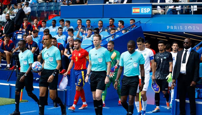 Teams and match officials walk out before the start of the match on July 24, 2024.  — Reuters