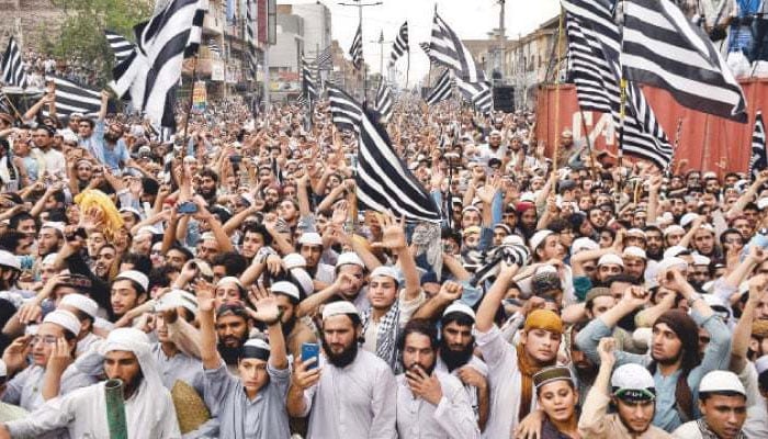 In this undated picture, activists of JUI-F stage a rally. — AFP/File