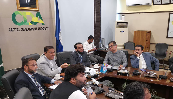 Federal Minister for Information, Broadcasting, and Culture, Attaullah Tarar along with Chairman CDA Chaudhry Muhammad Ali Randhawa speak at a meeting regarding arrangements for the Independence Day image released on July 24, 2024. — Facebook/Capital Development Authority - CDA, Islamabad