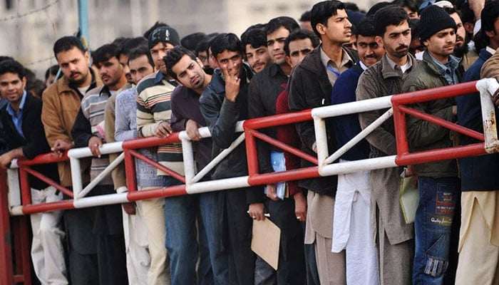 Pakistani youth wait for their turn for a Capital Development Authority (CDA) job entry test in Islamabad. — AFP/File