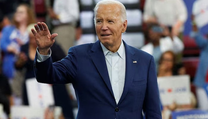 US President Joe Biden waves to his supporters during a campaign stop in Detroit, Michigan, U on July 12, 2024. — Reuters