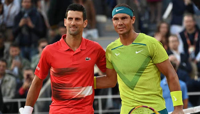 Tennis players Rafael Nadal (right) and Novak Djokovic pose for a picture during a match. — AFP/File