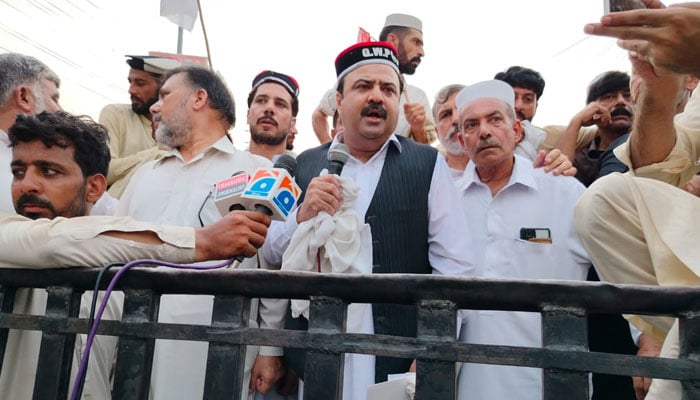 Qaumi Watan Party (QWP) provincial Chairman Sikandar Hayat Khan Sherpao addresses protesters at Tangi Tehsil Bazaar on July 25, 2024. — Facebook/Qaumi Watan Party