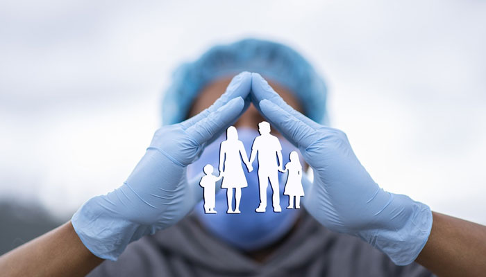 A representational image showing a medical professional gesturing over an illustration of a family. — Pixabay/File