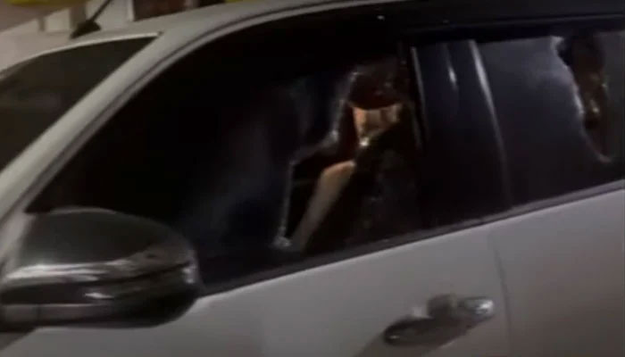 The image shows broken windows of a vehicle involved in a shootout in Karachis DHA on July 26, 2024. — Screengrab via YouTube/Geo News