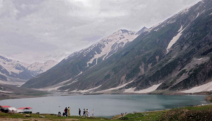 In this undated representational image, tourists gather at Lake Saiful Muluk in Pakistans Kaghan Valley. — AFP/File