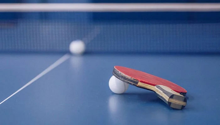 This representational image shows a ball and a tennis racket on the table. — APP/file