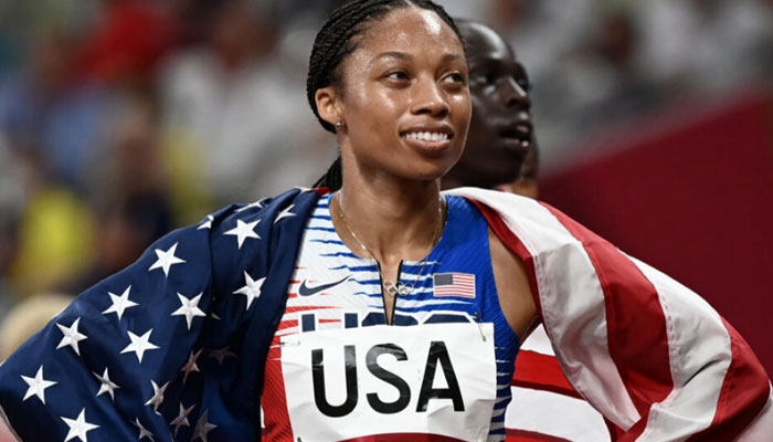 Olympic icon Allyson Felix carries the US flag at the Paris Olympics۔ — AFP/file