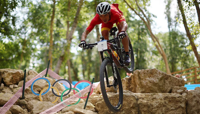 Mountain bike rider Jiujiang Mi of China cycling during training on July 24, 2024. — Reuters