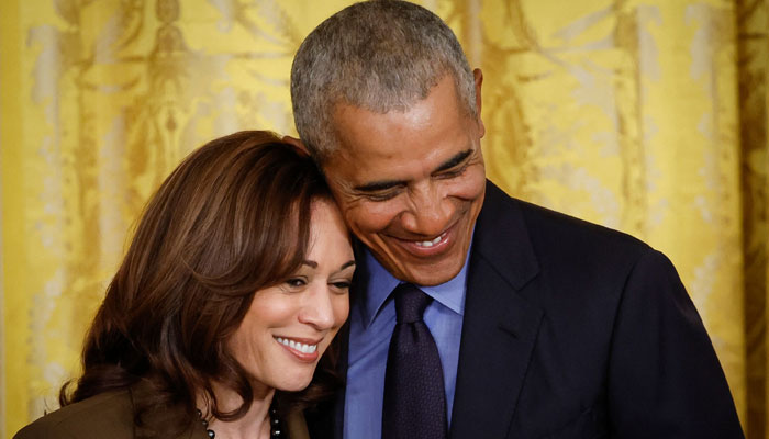 Former President Barack Obama hugs Vice President Kamala Harris during an event to mark the 2010 passage of the Affordable Care Act in the East Room of the White House on April 5, 2022 in Washington, DC. — AFP