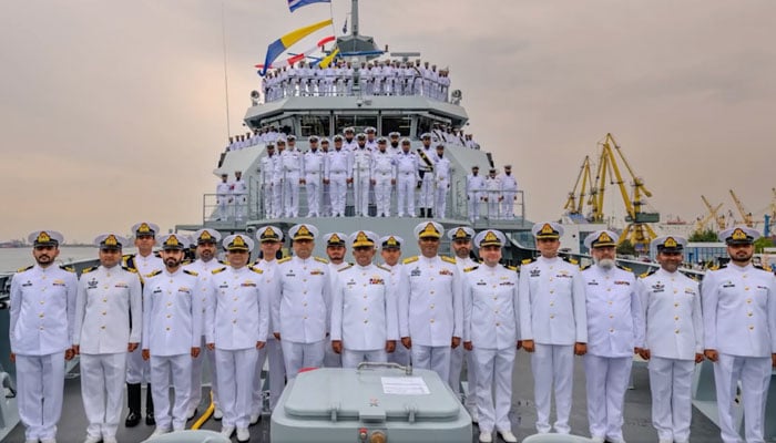 Pakistan Navy personnel pose for a photo onboard Pakistans offshore patrol vessel, PNS Hunain, during a ceremony in Romania on July 25, 2024. — Pakistan Navy/Facebook