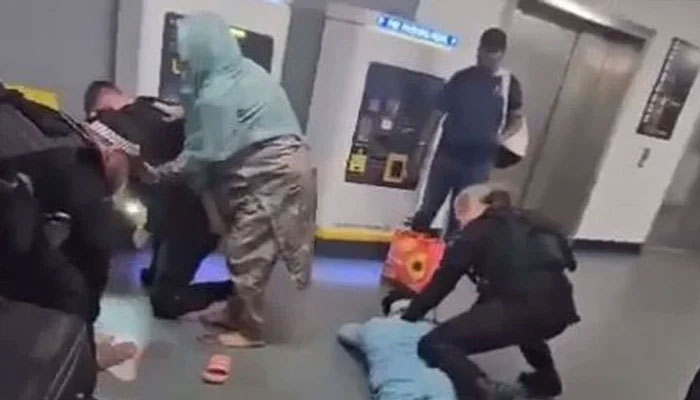 Police officers beats two young men at the Manchester Airport in this video released on July 24, 2024. — Screengrab via X/@MurtazaViews