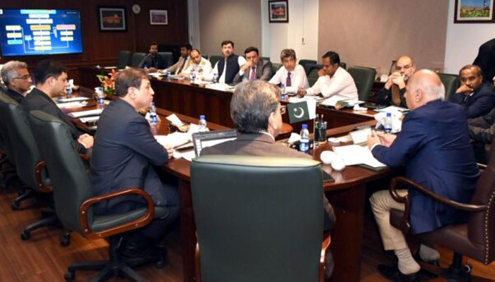 Maritime Minister Qaisar Ahmed Sheikh (centre), Chairperson of the KPT Syed Syedain Raza Zaidi (left to 2nd), former vice president of the FPCCI Khurram Ijaz (right to 3rd) and other seen in this image. July 5, 2024 — APP