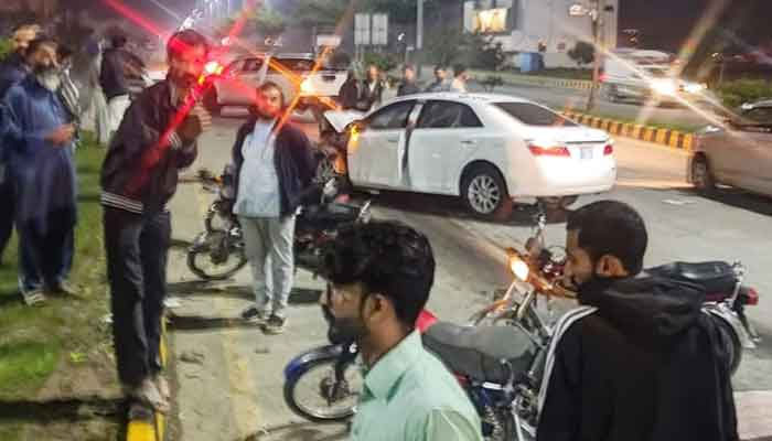 This representative image shows people gathered roadside following a road accident. — X/CTPLahore/File