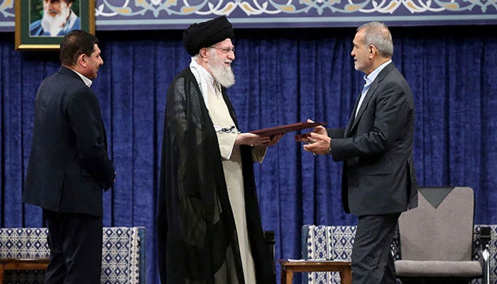 Irans Supreme Leader Ayatollah Ali Khamenei (centre) gives a Presidential decree to countrys president-elect Masoud Pezeshkian (right) during an endorsement ceremony in Tehran, Iran, July 28, 2024. — Reuters